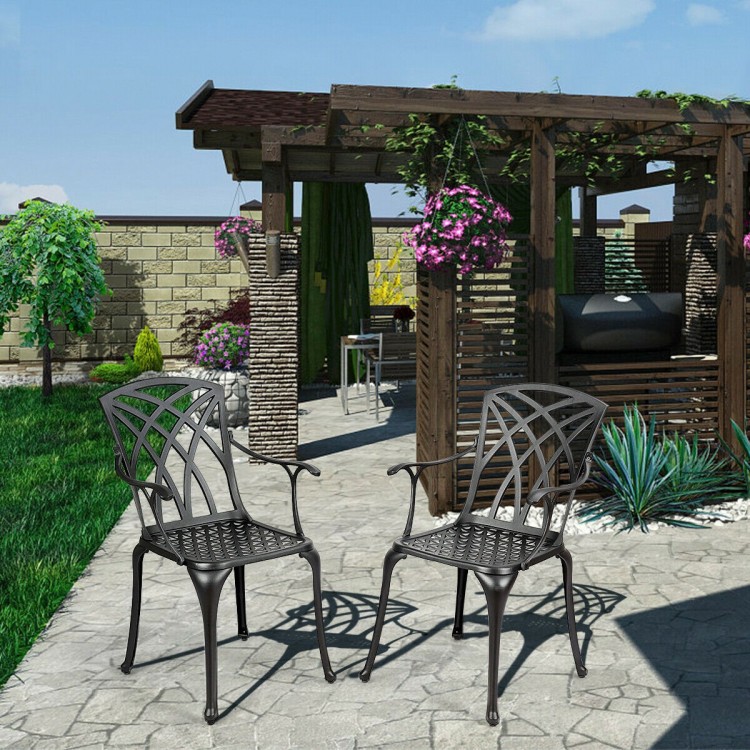 Two durable aluminum dining chairs with armrests, featuring a hollow out design, perfect for outdoor use in gardens or.