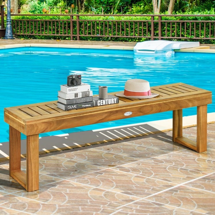 Acacia wood dining bench with slatted seat, natural teak color, ideal for poolside or outdoor furniture arrangements.