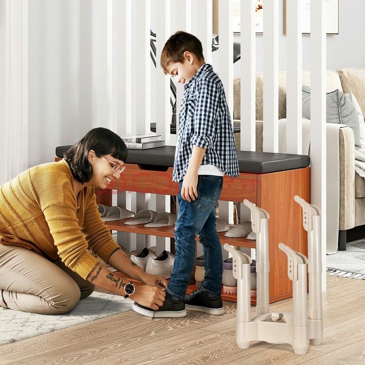 Electric shoe dryer with four brackets, timer, and heat blower, efficiently drying shoes in a cozy home setting.