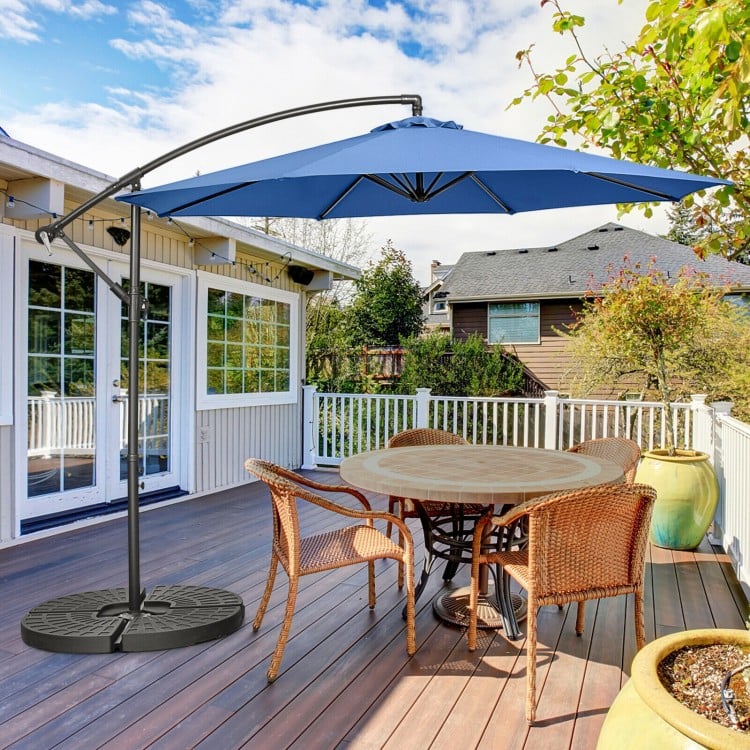 10FT blue offset umbrella with 8 ribs and cross base, providing adjustable shade for outdoor dining on a patio.