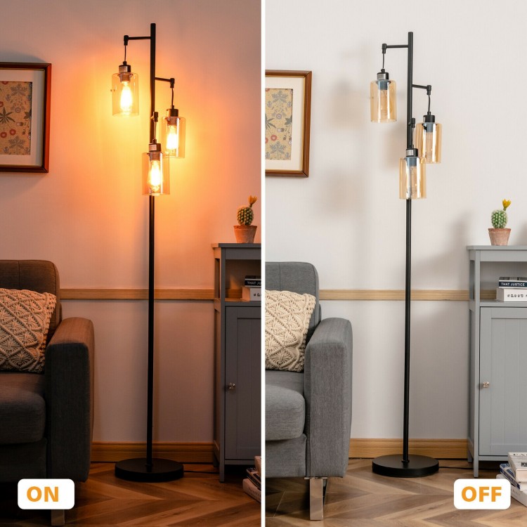 Retro floor lamp with three amber glass shades, featuring a stable iron base, ideal for living rooms and bedrooms.