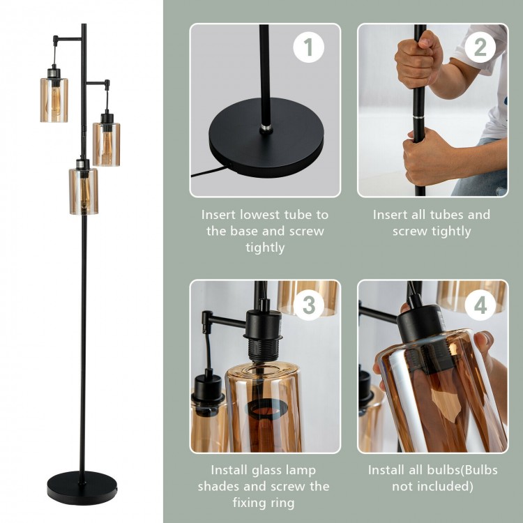 Retro floor lamp with three amber glass shades, stable iron base, ideal for living room or office lighting.