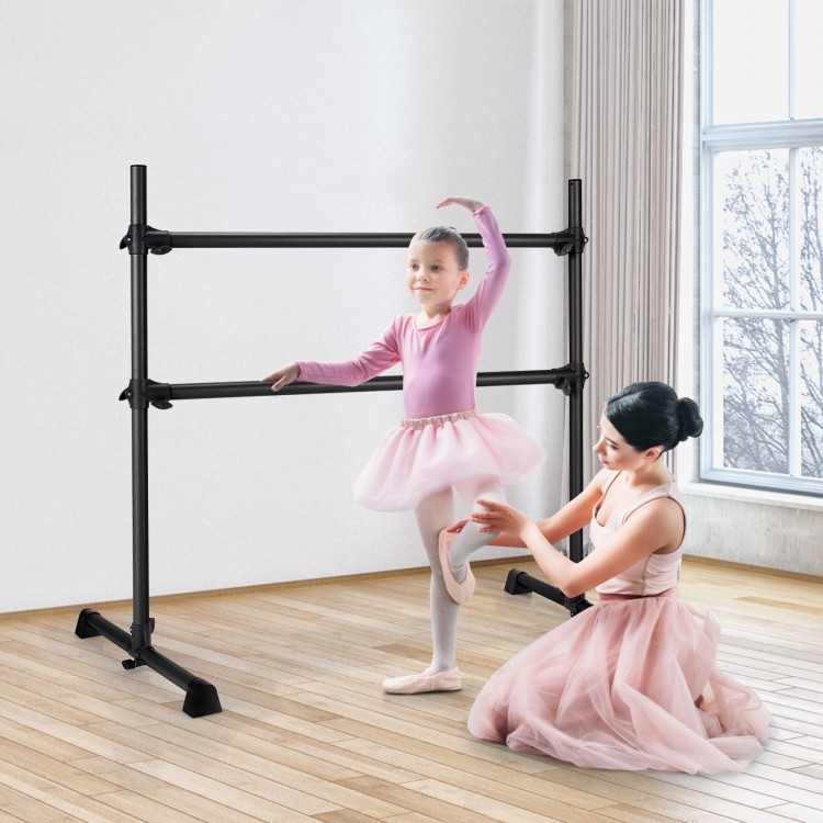 Freestanding black ballet barre for dancing and stretching, adjustable height, suitable for various ages and settings.