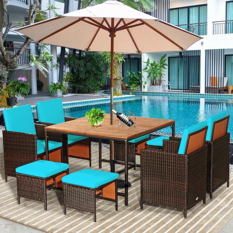 9-piece patio dining set with turquoise cushioned chairs and acacia wood tabletop, perfect for outdoor use by the pool.