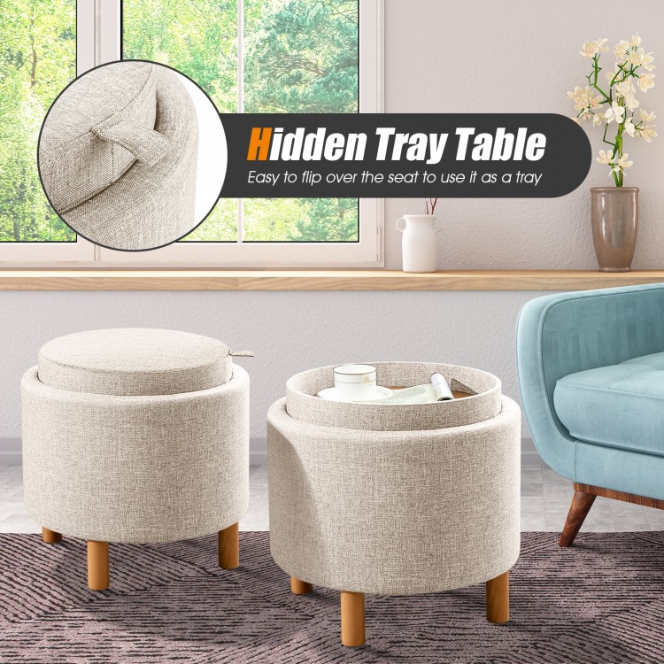 Round beige fabric storage ottoman with removable lid and wooden tray, perfect for snacks and concealed storage in any.