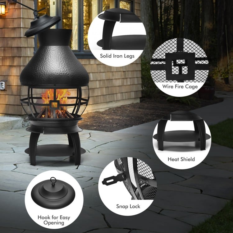 Patio wood burning chiminea fireplace with round wire mesh fire cage, solid iron legs, and heat shield for outdoor use.