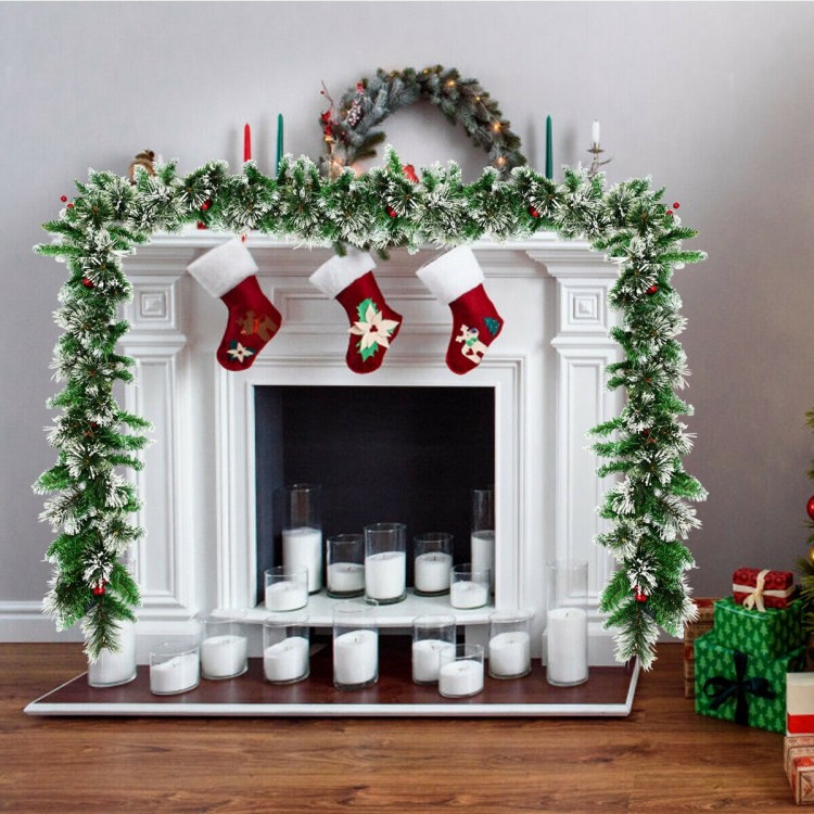 9-foot pre-lit Christmas garland with red berries and 50 LED lights, perfect for indoor or outdoor festive decoration.