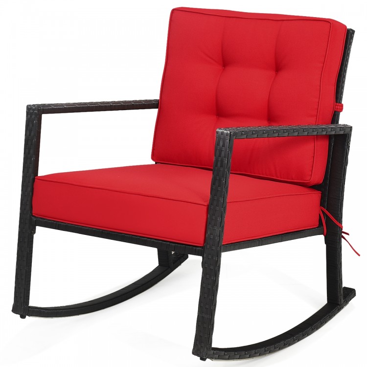 Red cushioned patio rattan rocking chair with sturdy metal frame, perfect for outdoor relaxation in the garden or patio.