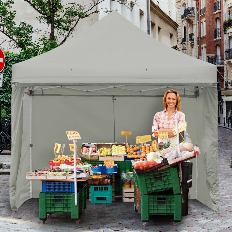 Pop-up gazebo with gray oxford fabric, adjustable height, ideal for outdoor events like markets and parties.