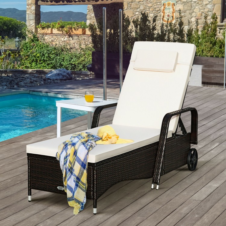 Cushioned outdoor recliner chaise lounge in white with adjustable backrest, perfect for poolside relaxation.