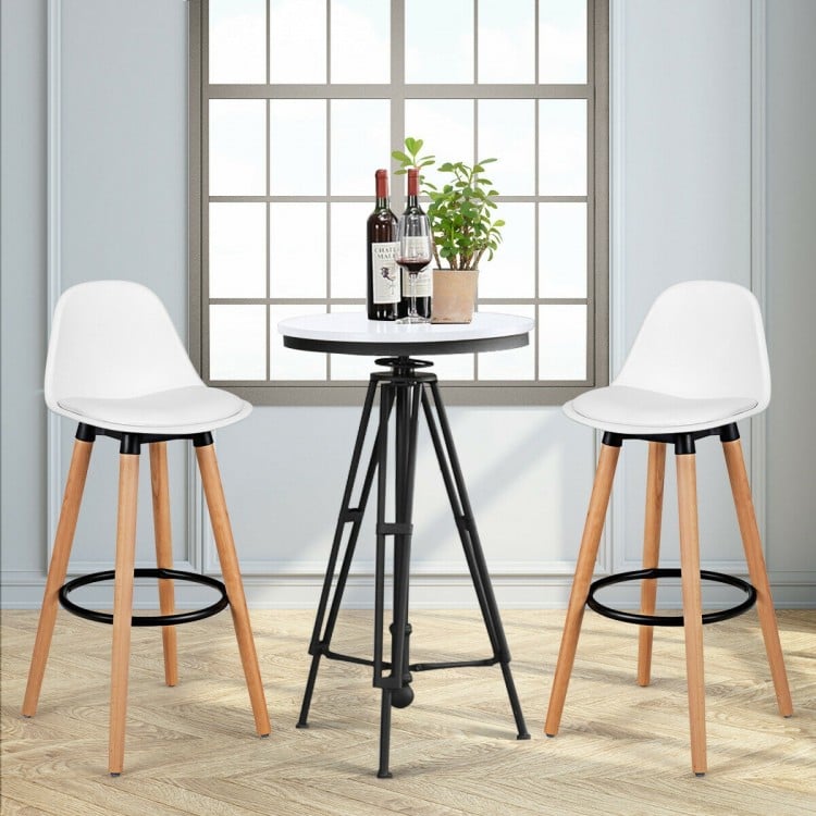 Mid-century barstools with white PU leather seats and beech wood legs, perfect for dining rooms or home bars.