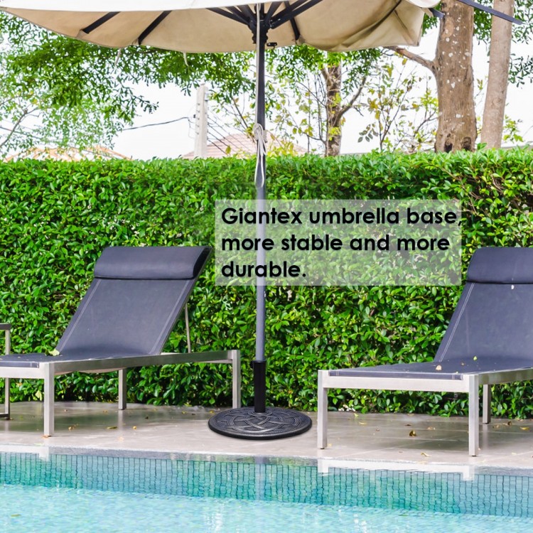 22-inch heavy-duty round umbrella base stand with bronze finish, providing stability for outdoor umbrellas by the pool.