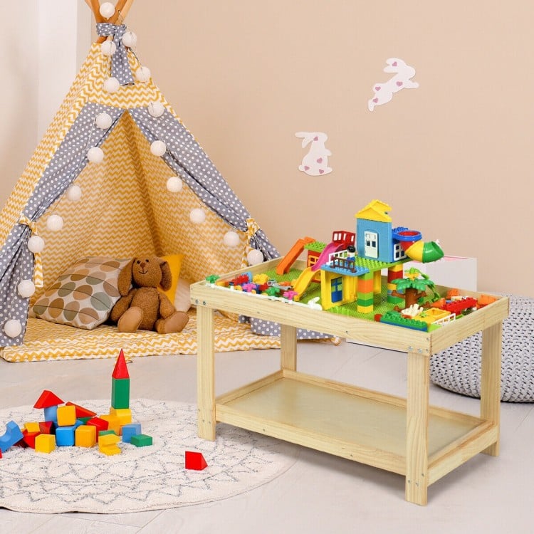 Kids activity play table made of natural pine wood, featuring a removable top and double storage for toys and books.
