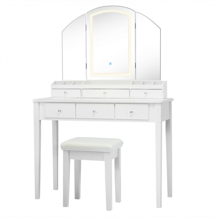 Vanity table set with tri-fold lighted mirror, 13 compartments, and padded stool for organized dressing in white.