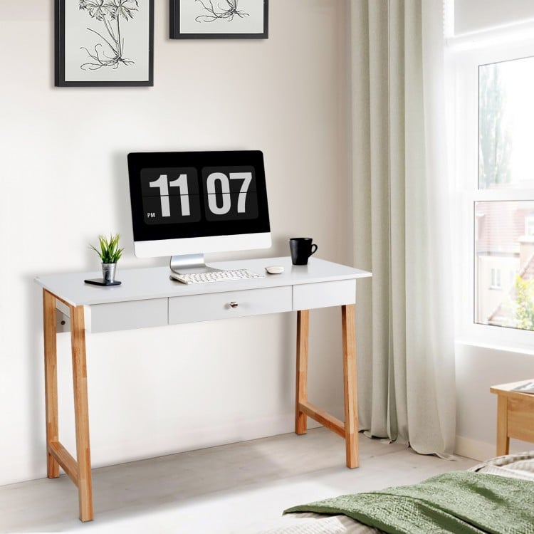 Modern computer desk with rubberwood legs, large drawer, and spacious desktop for home office or study use.