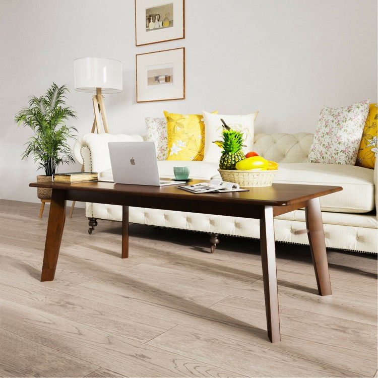 Rectangular modern wooden coffee table with rubber legs, featuring a large scratch-resistant tabletop for versatile use.
