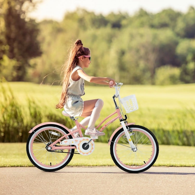 Kids' 18-inch pink bike with adjustable seat, training wheels, and detachable basket for safe and fun riding.