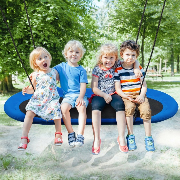 Oval 60-inch blue and black saucer swing with four children enjoying playtime in a park setting.