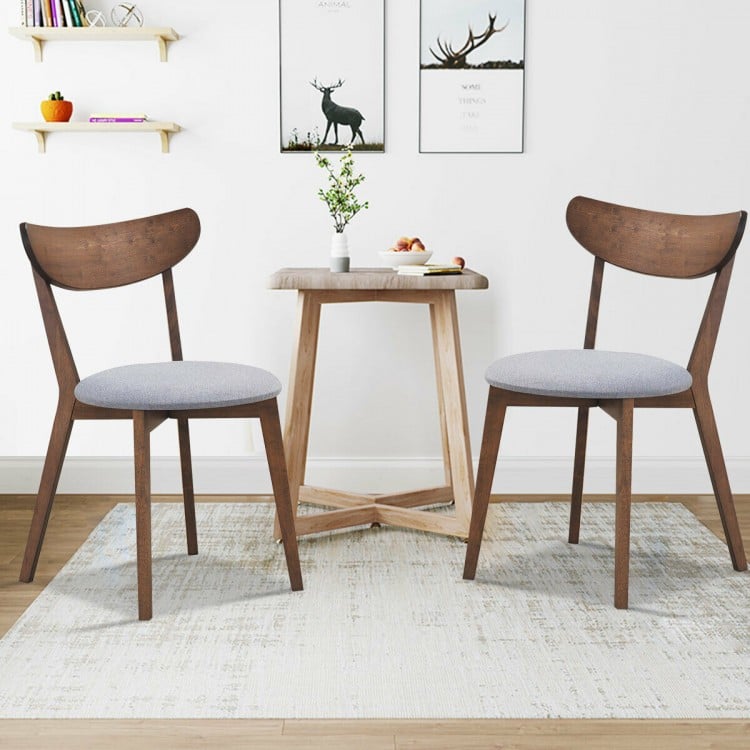 Set of 2 dining chairs with upholstered curved backs and rubber wood legs, ideal for kitchen or dining room use.
