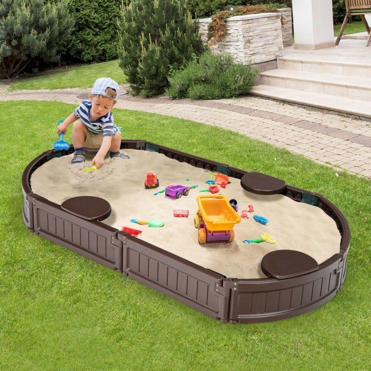 Sandbox with built-in corner seats in brown, featuring kids playing with toys, ideal for outdoor creativity and fun.