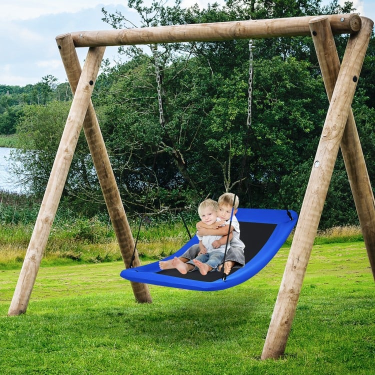 Giant 60-inch blue platform tree swing with solid steel frame, suitable for kids and adults in a backyard setting.