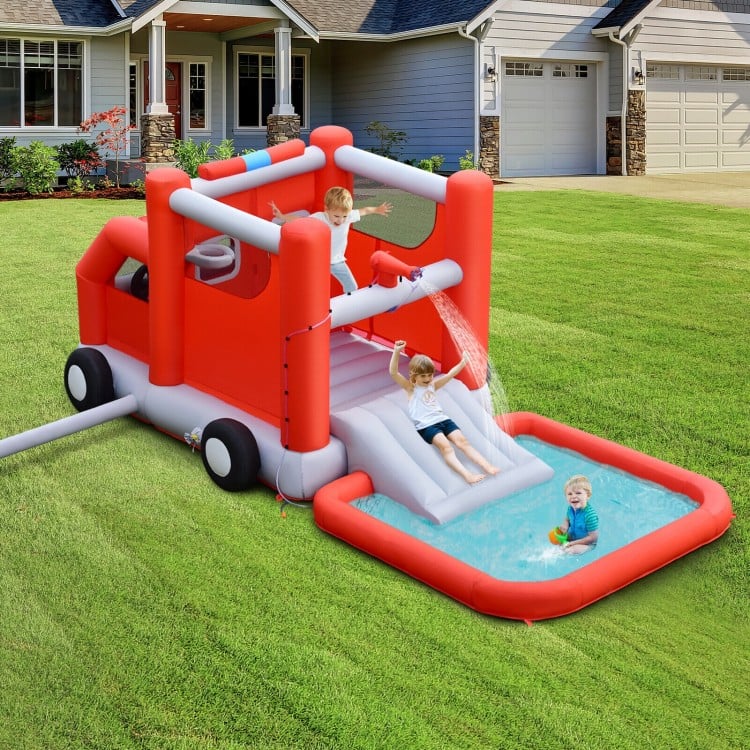 Fire truck-themed inflatable bounce house with slide and splash pool, perfect for kids' outdoor summer fun.