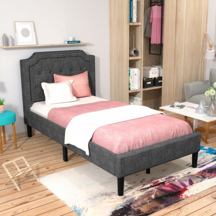 Twin upholstered platform bed with button-tufted headboard, soft fabric, and under-bed storage for a tidy room.