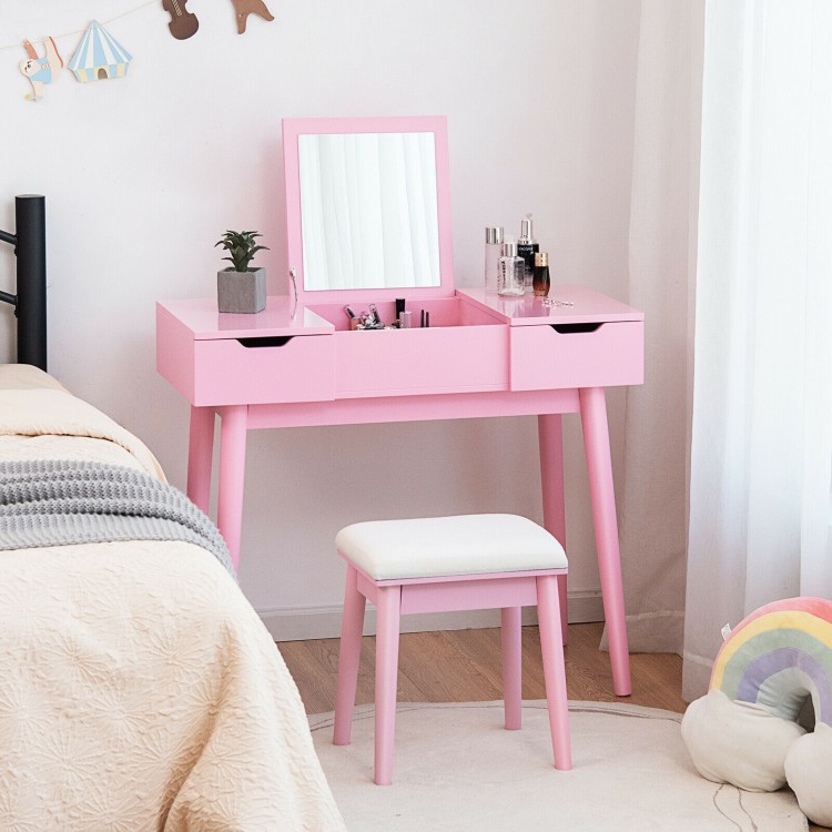 Pink makeup vanity table set with flip-top mirror, 2 drawers, and cushioned stool for stylish bedroom storage.