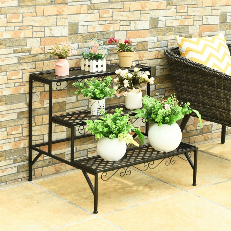 Three-tier metal decorative plant stand with elegant patterns, perfect for indoor or outdoor plant display.