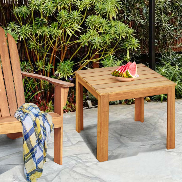 Wooden square patio coffee table in natural acacia wood, compact design, perfect for beside a chair in outdoor settings.