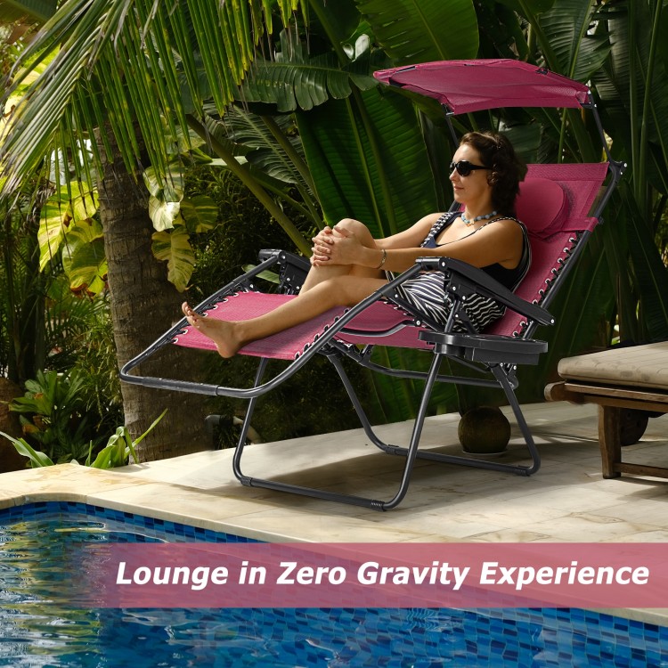 Folding recliner lounge chair with adjustable sun shade canopy and cup holder, perfect for outdoor relaxation by the.
