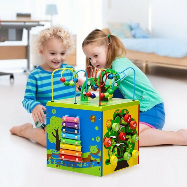 Colorful 5-in-1 wooden activity cube toy featuring a bead maze, xylophone, and educational games for kids aged 3+.