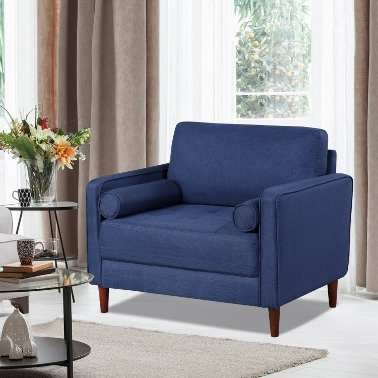 Oversized linen club armchair in blue with rubber wood legs and side pillows, perfect for modern living spaces.