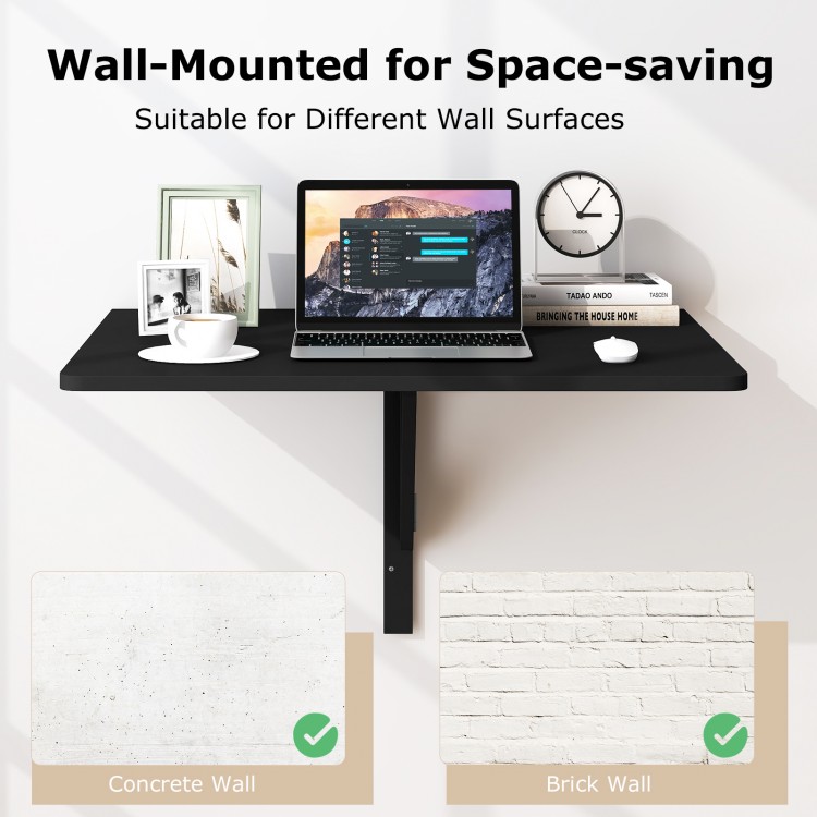 Wall-mounted black folding drop-leaf table with rounded edges, ideal for saving space in any room.