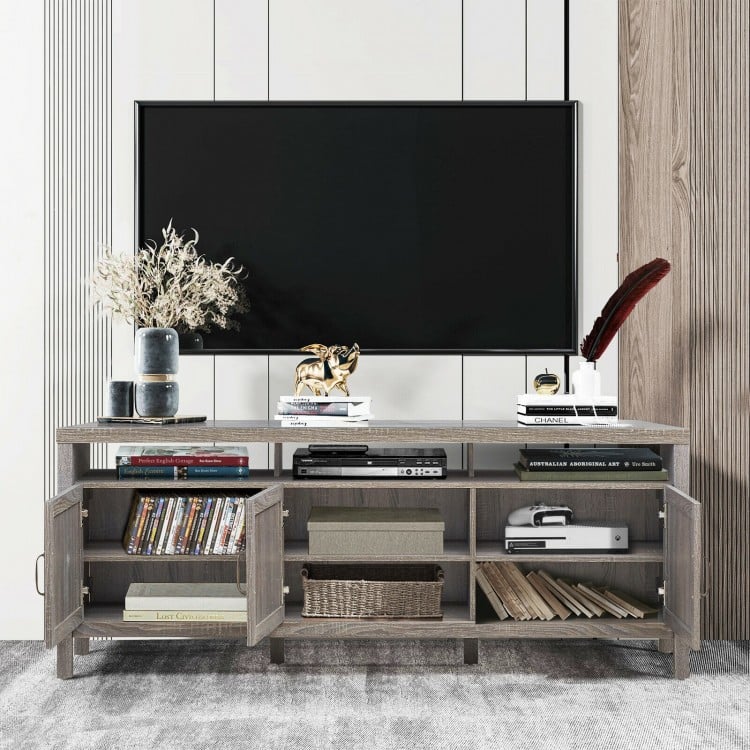 Gray universal TV stand with open shelf and three cabinets, designed for TVs up to 65 inches, offering ample storage.