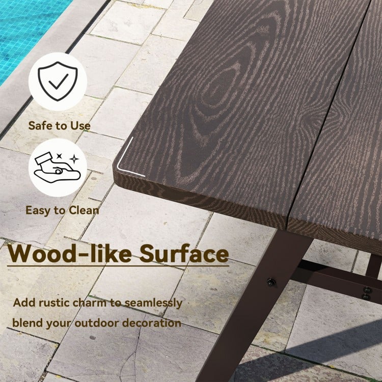 Wood-like surface of the outdoor picnic table, showcasing its smooth finish and rounded corners for easy cleaning.