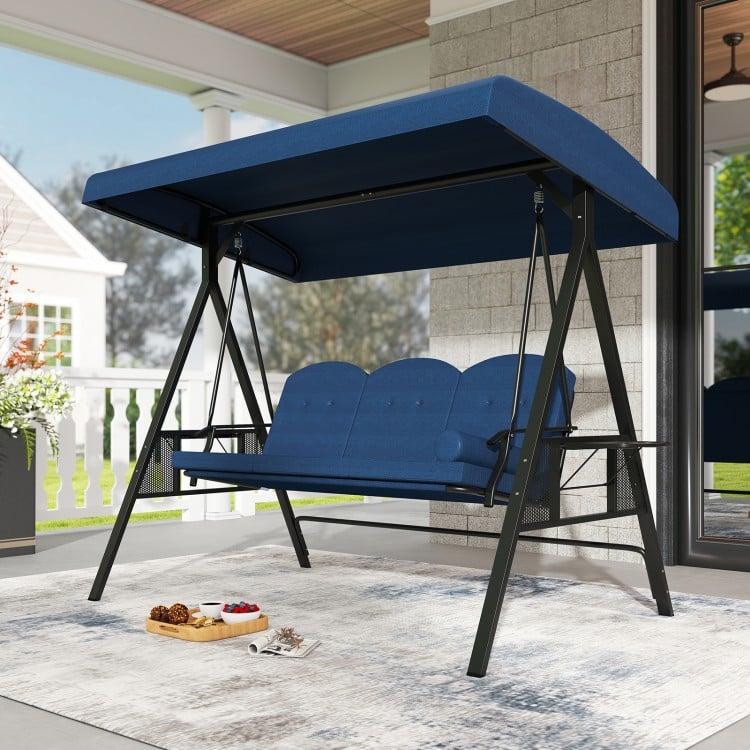 Navy 3-seat patio swing chair with adjustable canopy, thick cushions, and foldable side trays for outdoor relaxation.