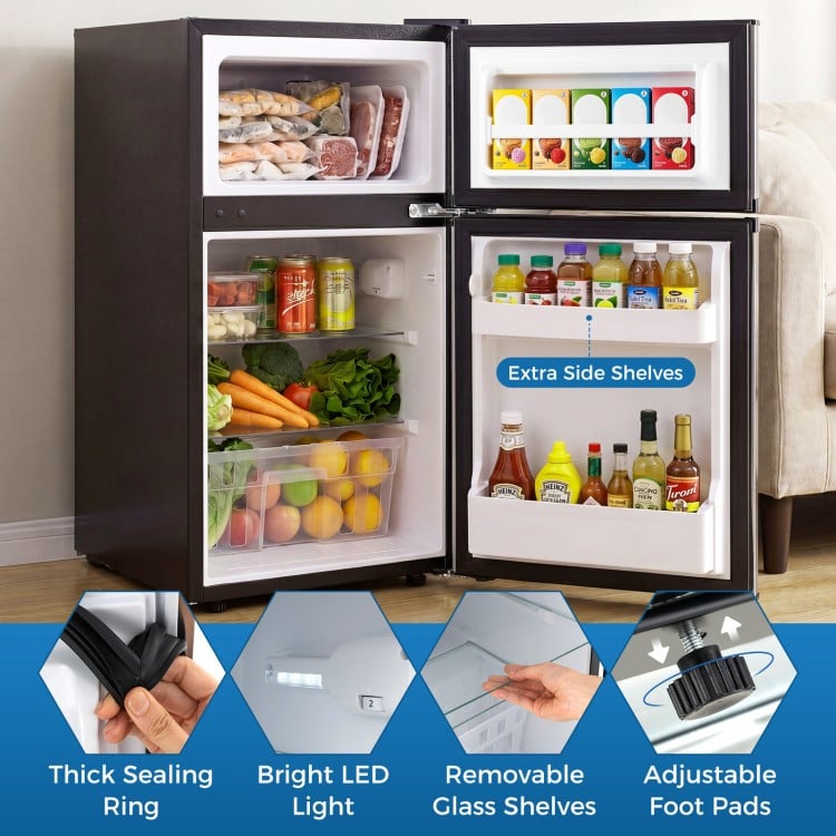 Mini fridge with freezer, adjustable thermostat, and removable glass shelves, perfect for small spaces like dorms.