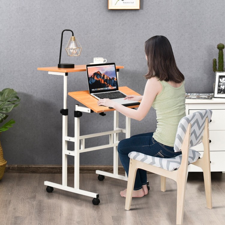 Height adjustable 2 in 1 sit-stand computer desk with tilting surface, ideal for home office or study use.