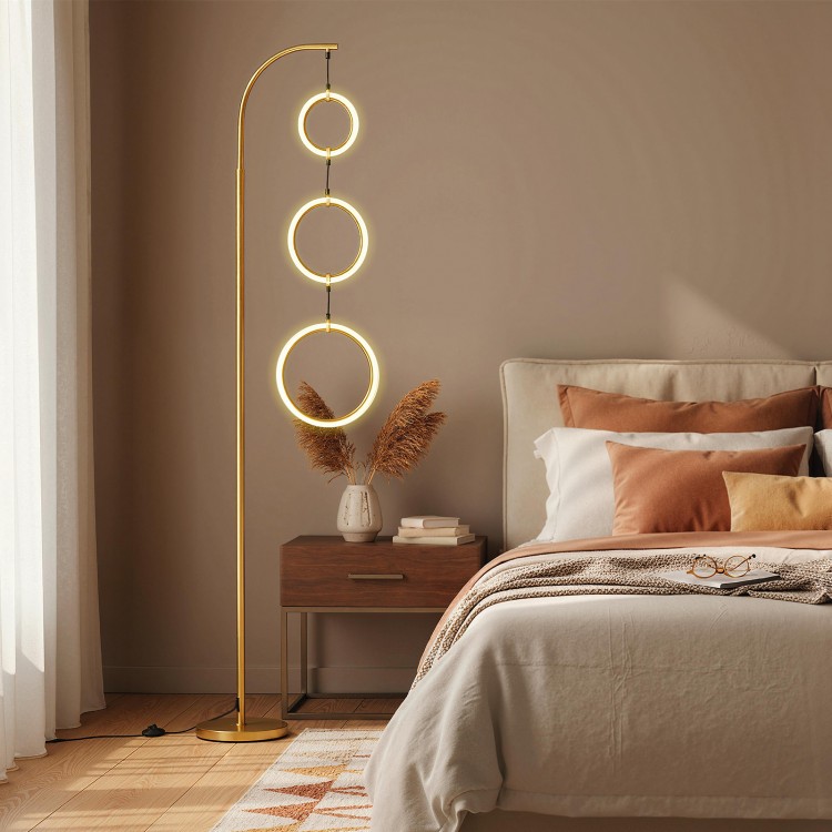Dimmable 3-circle LED floor lamp in gold with adjustable brightness and color temperatures, ideal for modern bedrooms.
