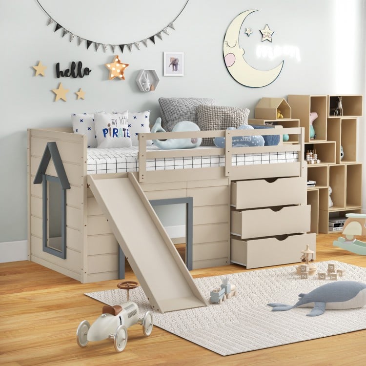 Beige twin loft bed with slide, featuring a sturdy design, protective handrails, and ample space for games underneath.