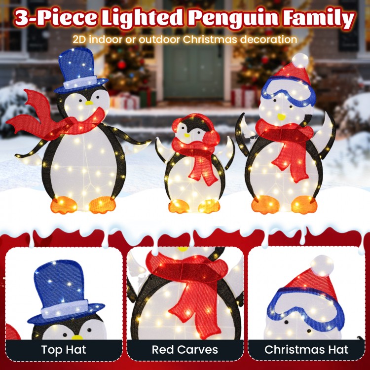 Close-up of the penguin dad in a top hat and red scarf, part of a 3-piece lighted Christmas decoration with 160 LED.