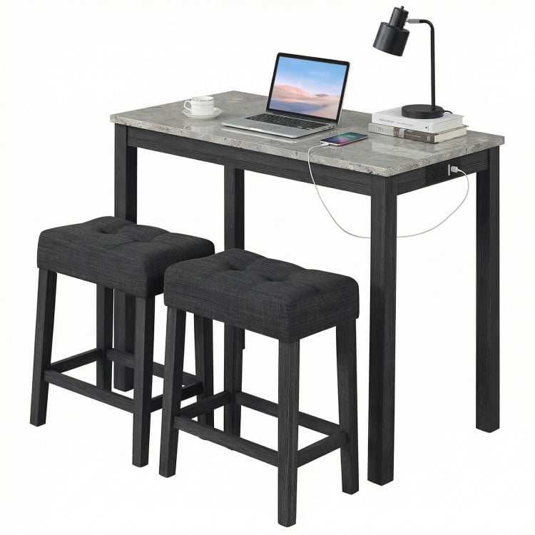 3-piece bar table set with faux marble top, includes 2 upholstered stools and side charging station for convenience.