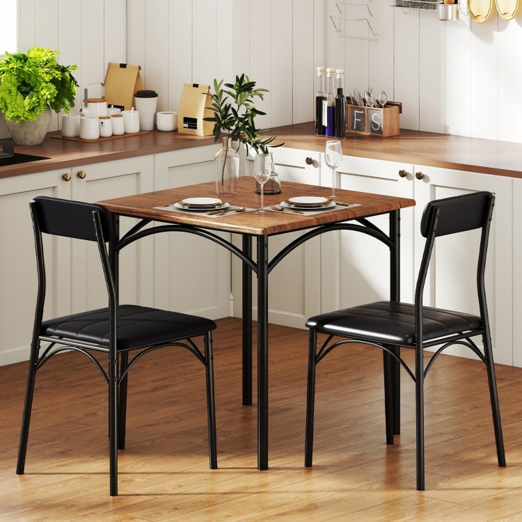 Square kitchen table set with rustic brown veneer and two black PU leather chairs for dining room use.