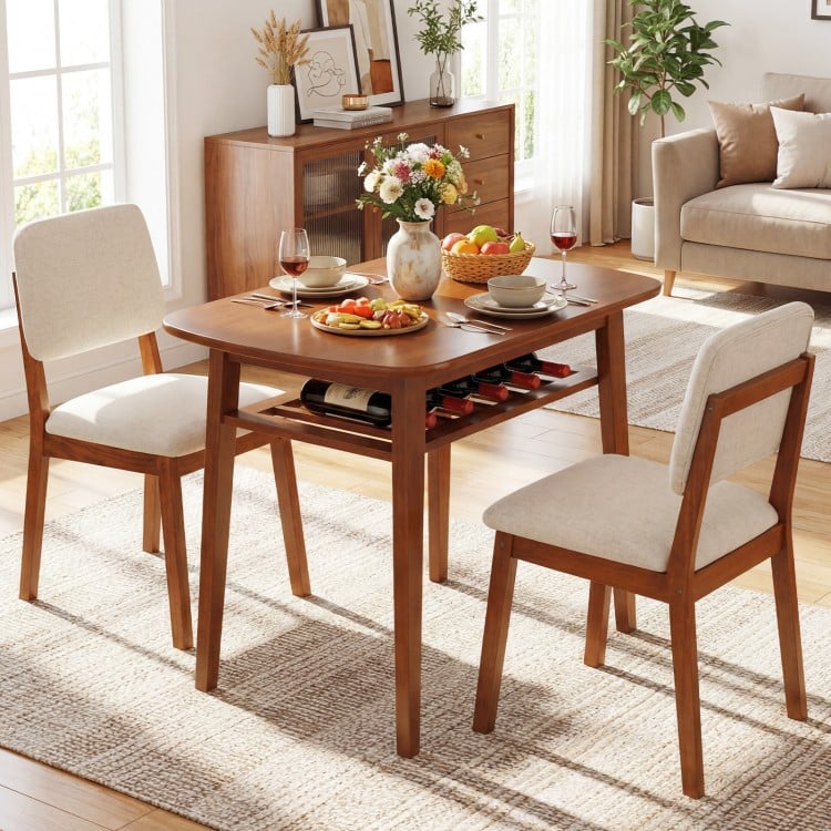 3-piece cherry dining table set for 2 with upholstered chairs, featuring a natural wood grain and built-in storage rack.