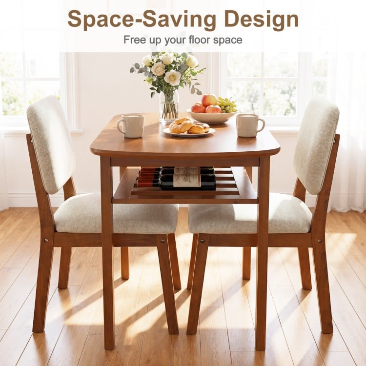 3-piece dining table set with upholstered chairs in cherry, featuring a space-saving design and built-in storage rack.