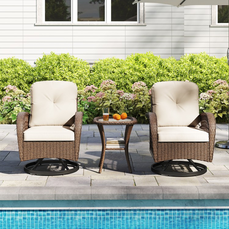 Patio swivel rocker set featuring rattan chairs with thick cushions and a tempered glass side table, ideal for poolside.