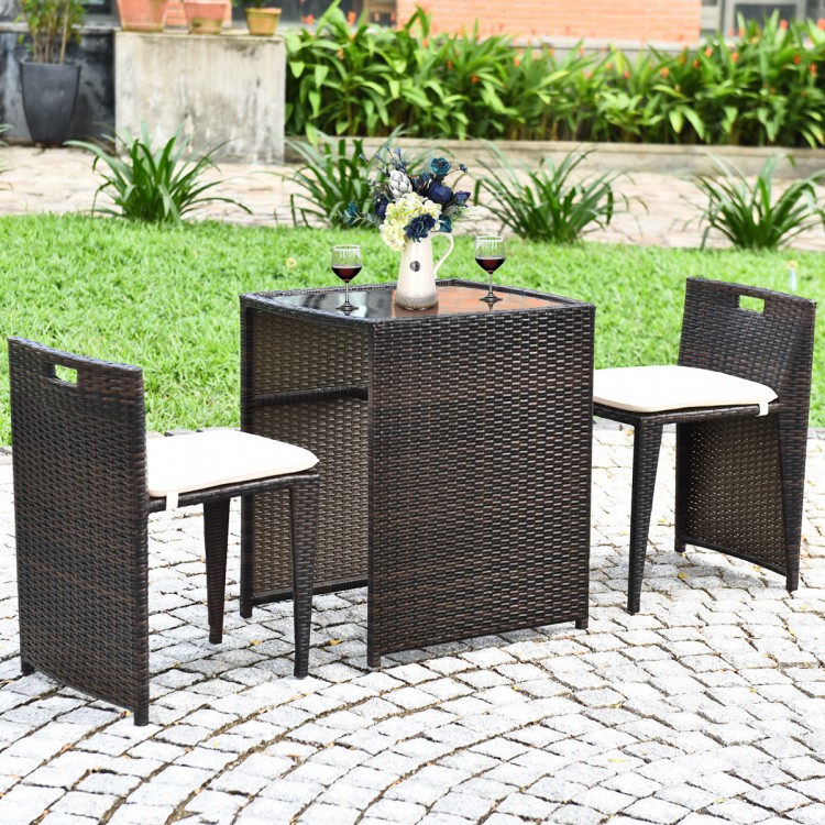Cushioned wicker patio bistro set featuring a strong steel frame, ideal for outdoor use on the patio or garden.