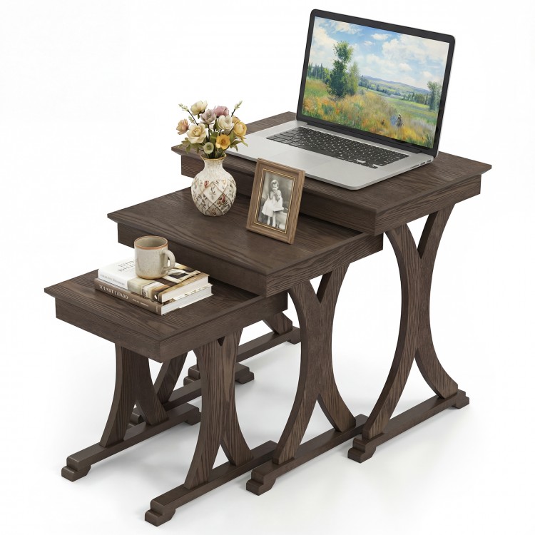 Nesting coffee table set of 3 in brown with solid rubber wood legs, ideal for living room or bedroom organization.