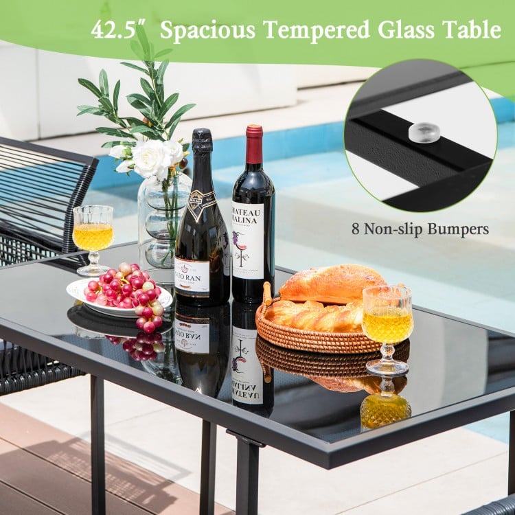 Spacious 42.5" tempered glass dining table with 8 non-slip bumpers, perfect for outdoor use by the poolside or deck.